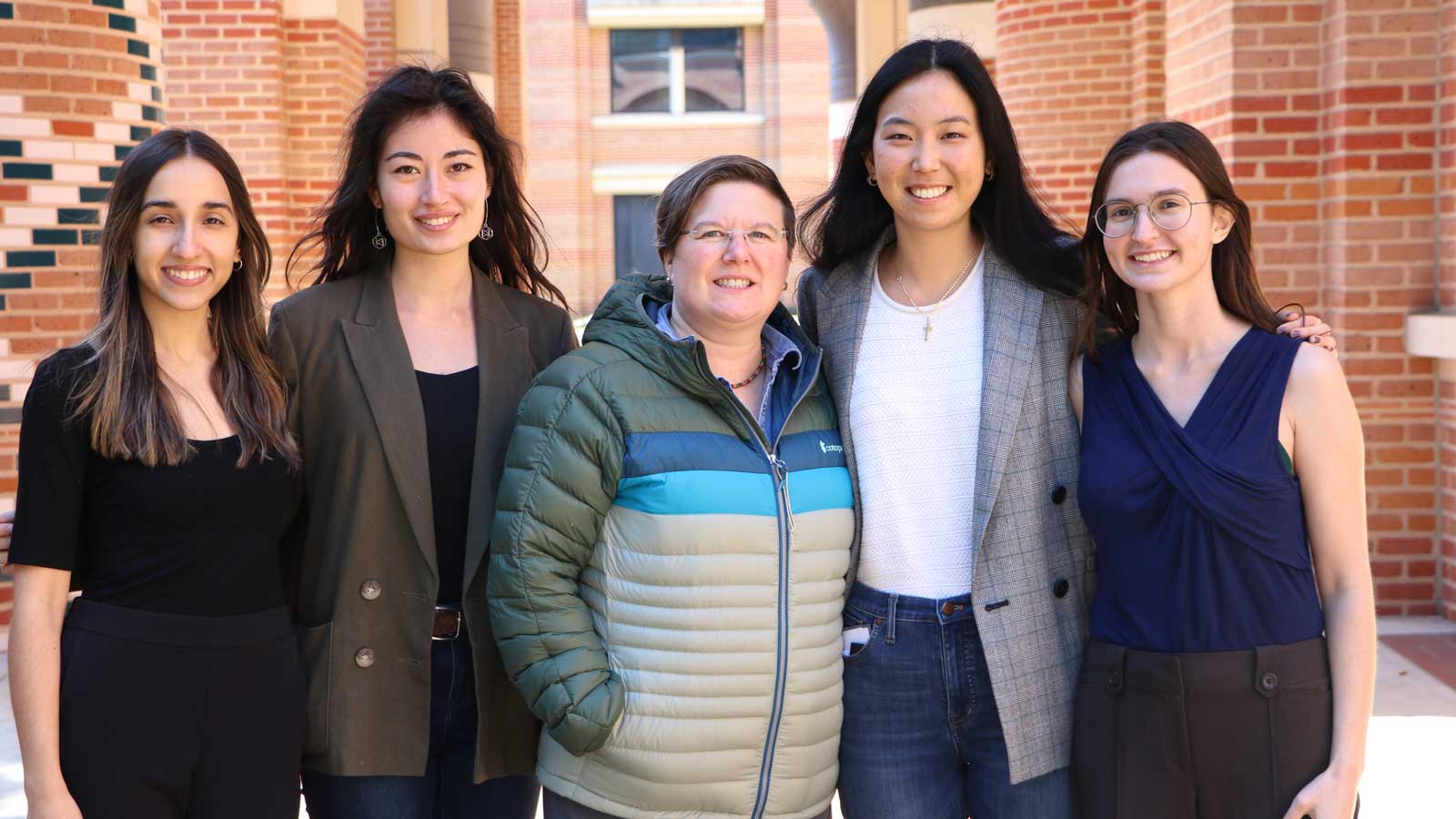 Bilyana Tzolova, Rachael Alfant, Shelly Harvey, Jaihee Choi, and Sara Edelman-Munoz posing for photograph on Rice University campus.